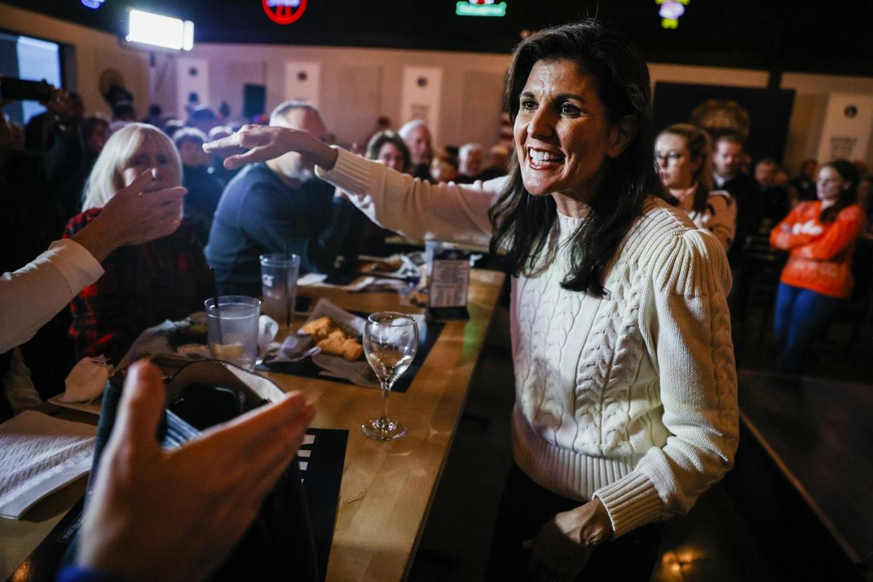 Republican presidential candidate Nikki Haley greets supporters on Jan. 3, 2024, at a bar in Londonderry, N.H. <a href="https://www.gettyimages.com/detail/news-photo/londonderry-nh-former-south-carolina-governor-and-news-photo/1902583157?adppopup=true" rel="nofollow noopener" target="_blank" data-ylk="slk:Erin Clark/The Boston Globe via Getty Images;elm:context_link;itc:0;sec:content-canvas" class="link ">Erin Clark/The Boston Globe via Getty Images</a>