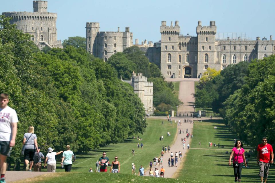 People enjoy the hot weather on the Long Walk at Windsor Castle, Berkshire (PA)