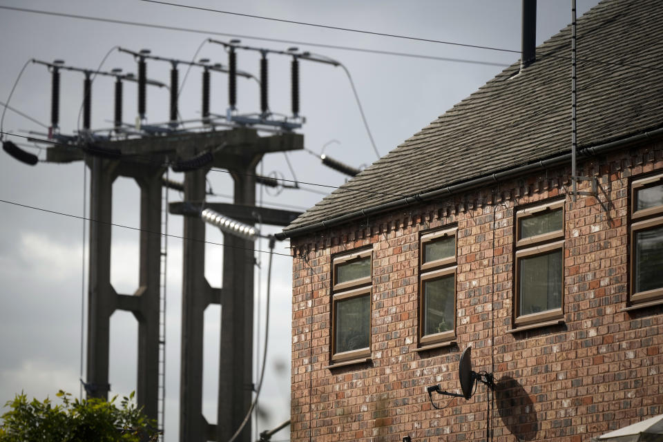 energy bills BURTON ON TRENT, ENGLAND - OCTOBER 11: An electricity sub station pylon stands next to a home on October 11, 2022 in Burton On Trent, England. The British utility company, National Grid, said this week that UK households may face power cuts this winter for up to three hours at a time, if gas supplies run low. The UK relies heavily on gas to produce electricity, and gas supplies to Europe have been severely disrupted by the fallout from Russia's invasion of Ukraine. (Photo by Christopher Furlong/Getty Images)