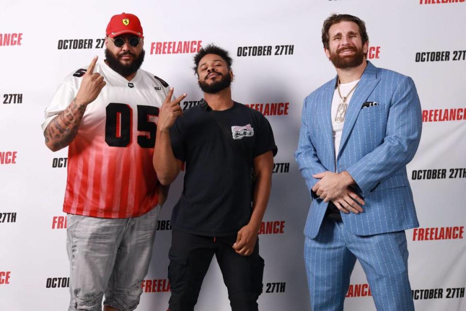 WWE alum and Miami Dolphins alum AJ Francis (left), WWE Superstar Ashante “Thee” Adonis (middle) and WWE alum and TMZ Sports Show Host Mojo Rawley before a screening for the John Cena action comedy movie “Freelance” at Regal Cinemas in the Waterford Lakes Plaza, near the University of Central Florida in Orlando. Francis, Adonis and Rawley are also University of Maryland alums. Photo By Harry Aaron/Courtesy RMG