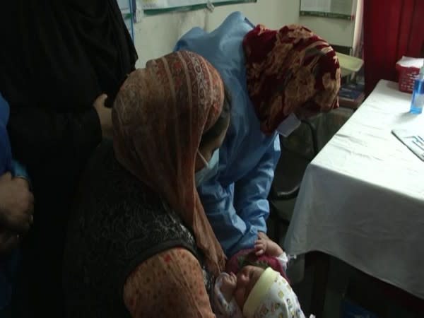 An infant being administered pneumococcal vaccine in Srinagar on Saturday. [Photo/ANI]