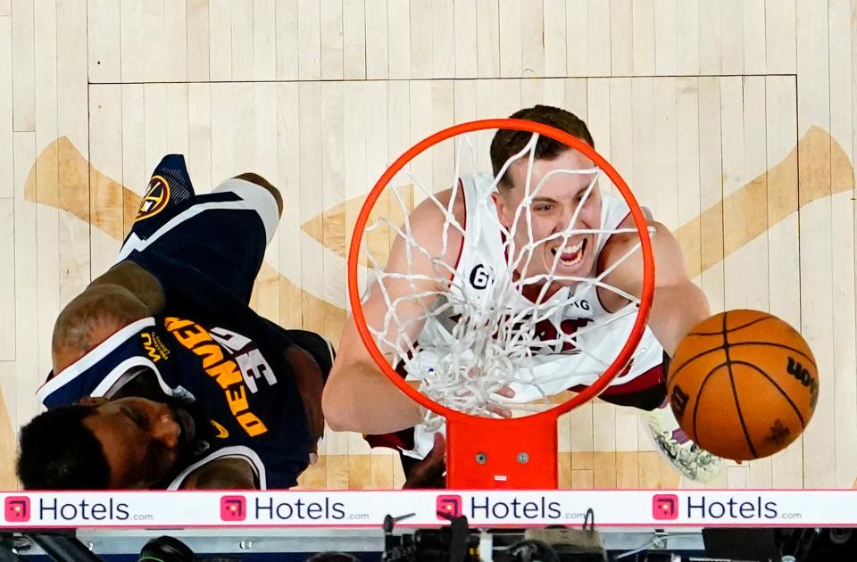 Miami forward Duncan Robinson shoots against Denver forward Jeff Green during Game 2 of the 2023 NBA Finals at Ball Arena.