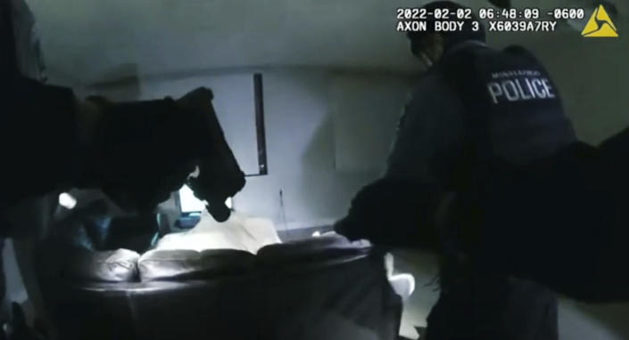 In this image taken from Minneapolis Police Department body camera video and released by the city of Minneapolis, Minneapolis police enter an apartment on Wednesday, Feb. 2, 2022, moments before shooting 22-year-old Amir Locke. (Minneapolis Police Department via AP)