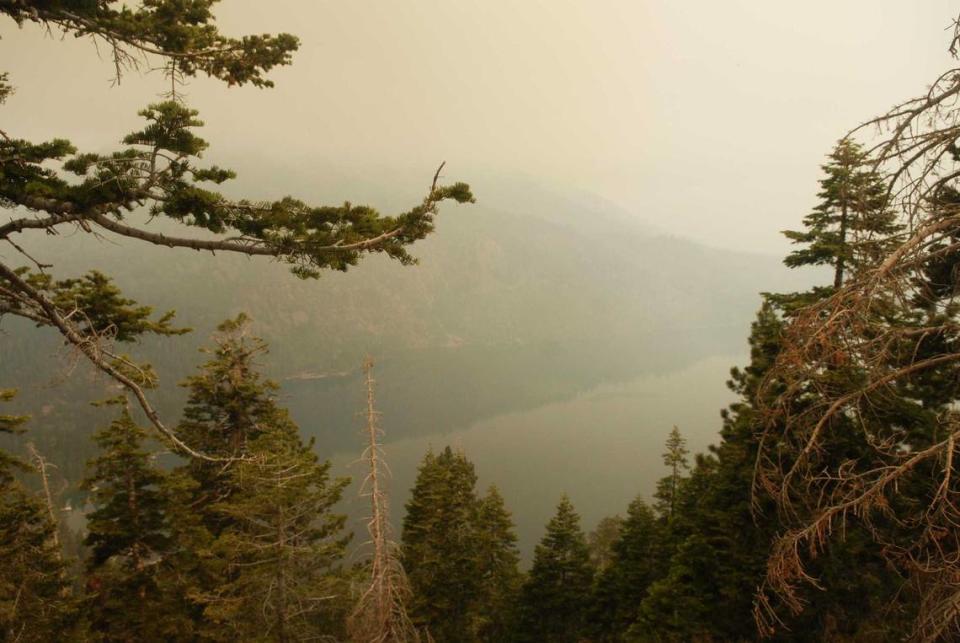 The normally scenic view of Lake Tahoe from a lookout point on Tahoe Mountain Road is gloomy with smoke following a large fire in the South Lake Tahoe area in 2007. Researchers at UC Davis say as wildfire activity has grown, the state’s pristine bodies of water have been affected by smoke.