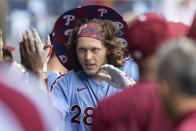 Philadelphia Phillies' Alec Bohm celebrates in the dugout after hitting a home run during the fourth inning of a baseball game against the Washington Nationals, Thursday, July 29, 2021, in Philadelphia in the second game of a doubleheader. (AP Photo/Laurence Kesterson)