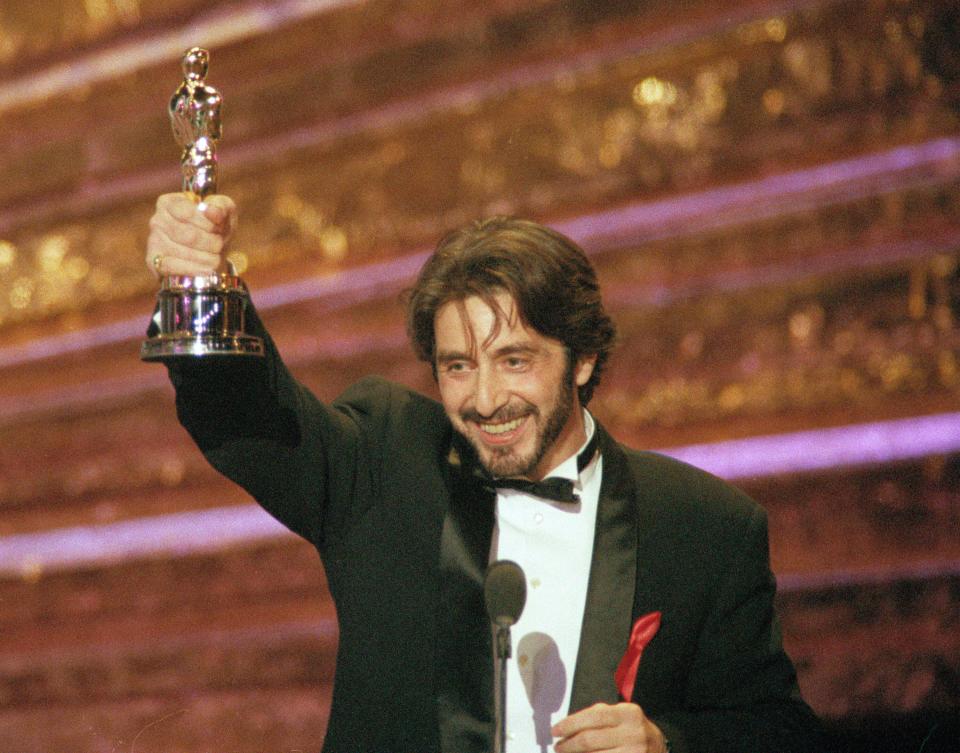 Actor Al Pacino holds up the the Oscar he won as best actor for his role in 