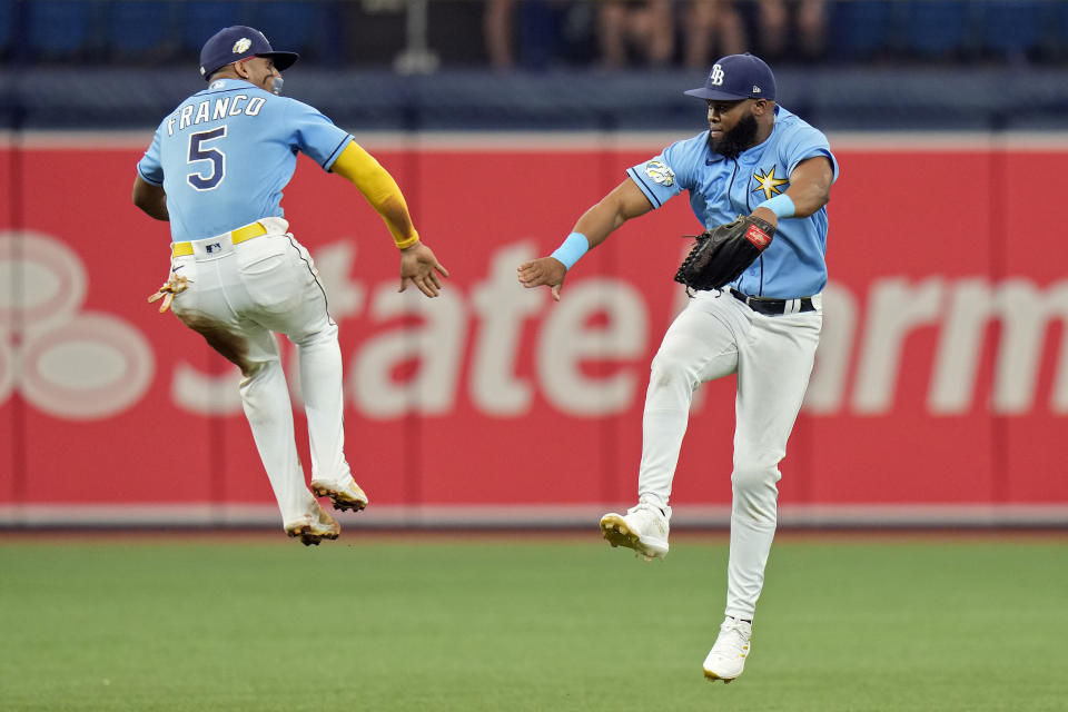 Tampa Bay Rays shortstop Wander Franco (5) celebrates with center fielder Manuel Margot after the team defeated the Chicago White Sox during a baseball game Sunday, April 23, 2023, in St. Petersburg, Fla. (AP Photo/Chris O'Meara)