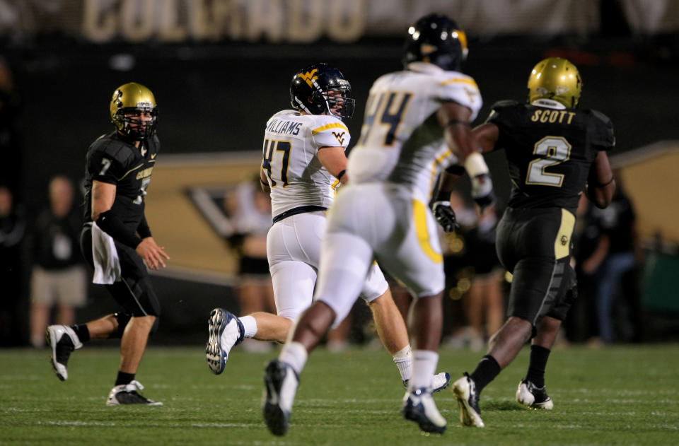 BOULDER, CO – SEPTEMBER 18: Linebacker Reed Williams #47 of the West Virginia Mountaineers returns an interception thrown by Cody Hawkins #7 of the Colorado Buffaloes in the second quarter at Folsom Field on September 18, 2008 in Boulder, Colorado. (Photo by Doug Pensinger/Getty Images)