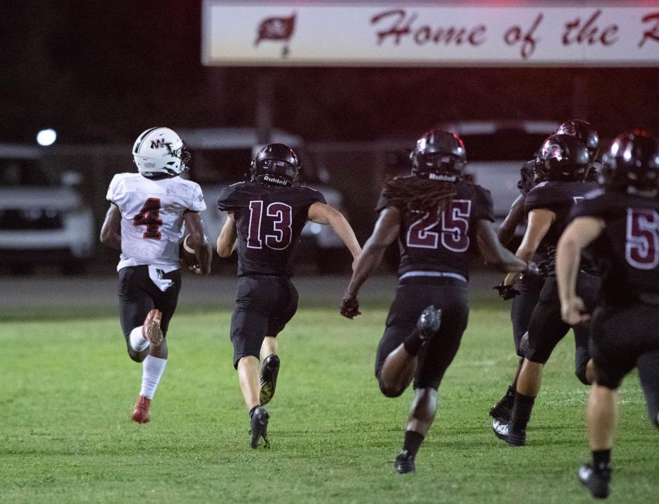 Marquez Jones (4) returns a kickoff for a touchdown and a 32-20 Jaguars lead during the West Florida vs Navarre preseason football game at Navarre High School on Friday, Aug. 18, 2023.