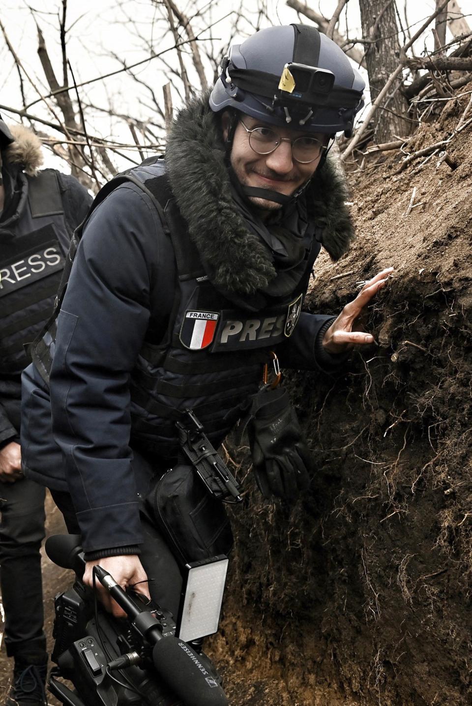 (FILES) AFP journalist Arman Soldin, walks in a trench as he is covering the war in Ukraine on March 18, 2023. Arman was killed by a rocket strike as he reported with AFP colleagues from Ukrainian positions in Chasiv Yar on May 9, 2023. Arman, who was 32 and born in Bosnia, began his career as an AFP intern in the Rome bureau before moving to London in 2015. He was formally appointed as Ukraine video coordinator for AFP based in Kyiv in September 2022. Arman's death is a terrible reminder of the risks and dangers of covering this war. Our thoughts tonight are with his family and friends, and with all AFP people on the ground in Ukraine. (Photo by Aris MESSINIS / AFP) (Photo by ARIS MESSINIS/AFP via Getty Images)