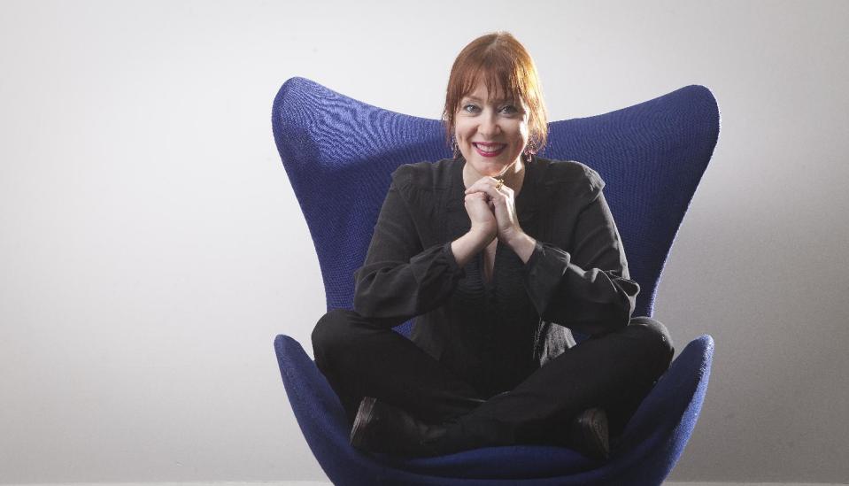 This March 7, 2014 photo shows Suzanne Vega in New York. Vega's latest release is "Tales From the Realm of the Queen of Pentacles." (Photo by Carlo Allegri/Invision/AP)