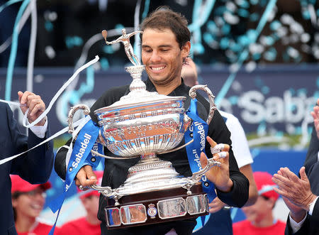 Tennis - Barcelona Open Final - Rafael Nadal of Spain v Dominic Thiem of Austria - Real Club de Tenis Barcelona, Spain - 30/04/17 - Rafael Nadal raises up the trophy. REUTERS/Albert Gea