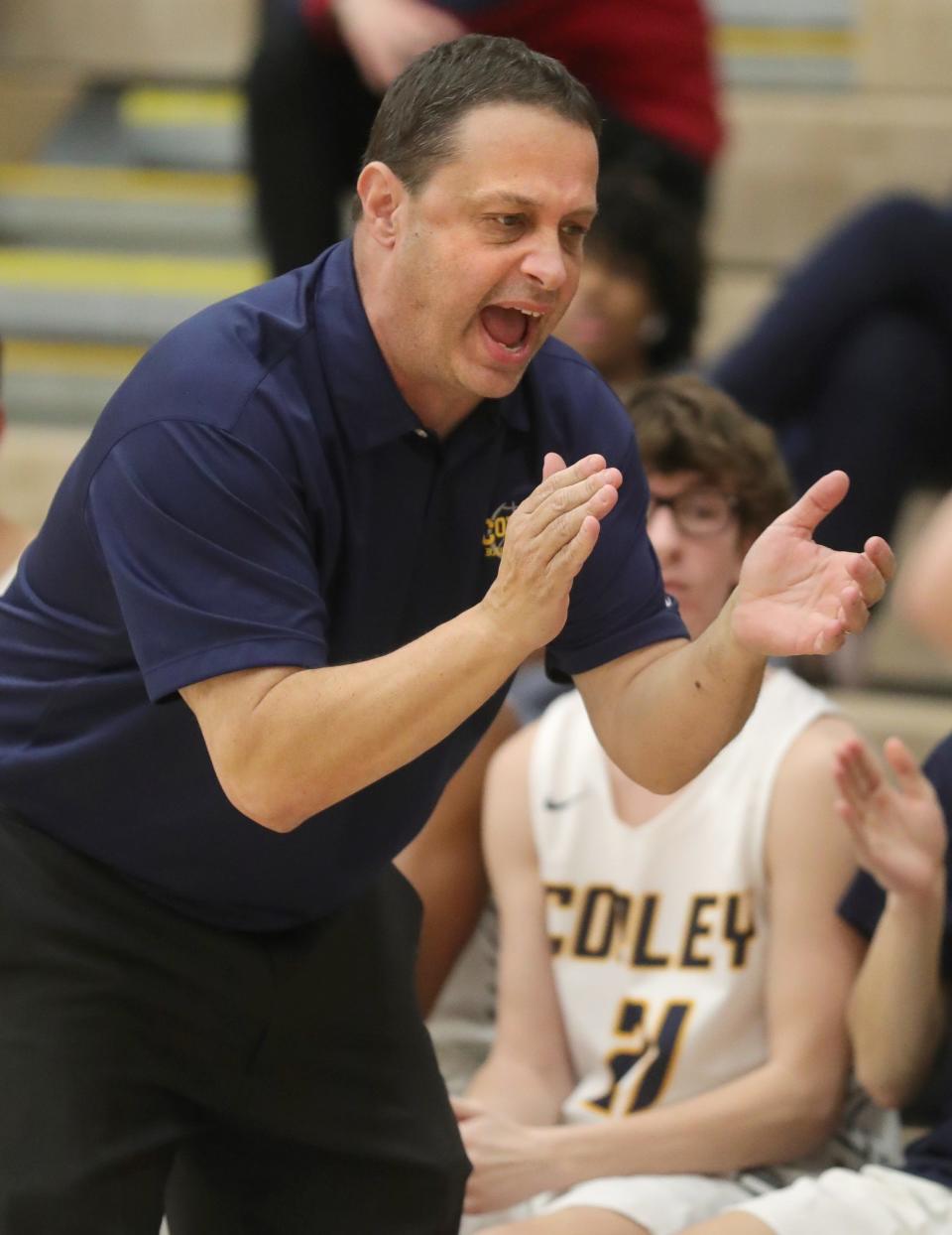 Copley coach Mark Dente gets his team fired up against Revere on Feb. 8 in Copley.