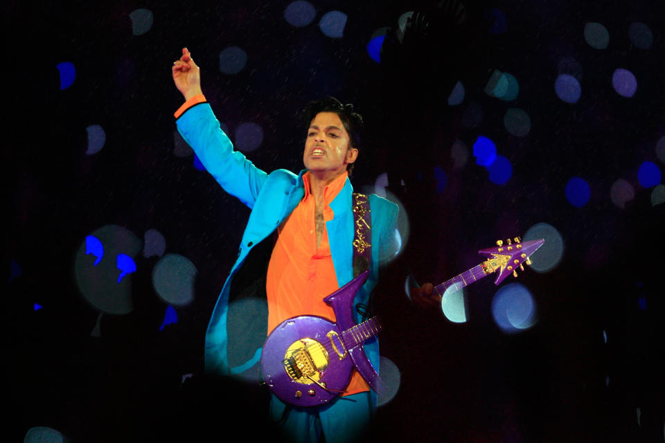 Prince performs in the rain during the 'Pepsi Halftime Show' at Super Bowl XLI between the Indianapolis Colts and the Chicago Bears on February 4, 2007 at Dolphin Stadium in Miami Gardens, Florida. (Photo by Jamie Squire/Getty Images)