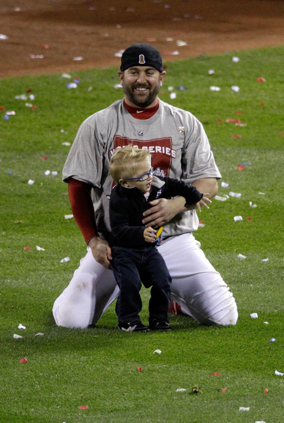 ST LOUIS, MO - OCTOBER 28: Nick Punto #8 of the St. Louis Cardinals celebrates with family after defeating the Texas Rangers 6-2 to win the World Series in Game Seven of the MLB World Series at Busch Stadium on October 28, 2011 in St Louis, Missouri. (Photo by Rob Carr/Getty Images)