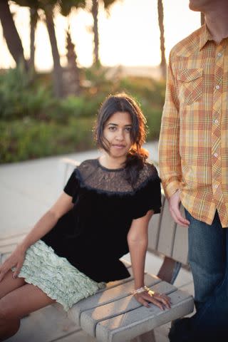 <p>Courtesy of Avni Shah/ InStyle</p> An engagement photoshoot in Newport Beach, CA. Free People lace top and J. Crew ruffle skirt.