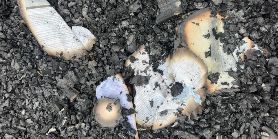 Scraps of half-burned textbook pages found in the dormitory of Mahdia Secondary School in Guyana after a massive blaze on May 21, 2023.