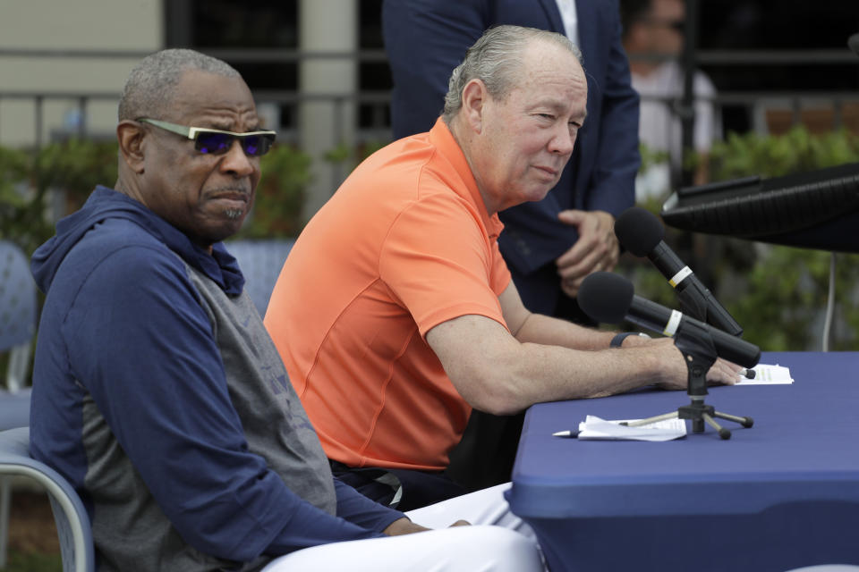 Houston Astros owner Jim Crane, right, and manager Dusty Baker listen to a question during a news conference before the start of the first official spring training baseball practice for the team Thursday, Feb. 13, 2020, in West Palm Beach, Fla. (AP Photo/Jeff Roberson)