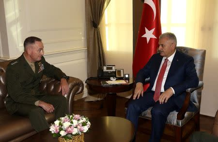 Turkish Prime Minister Binali Yildirim (R) meets with U.S. Joint Chiefs of Staff General Joseph Dunford in Ankara, Turkey, August 1, 2016. Picture taken August 1, 2016. Mustafa Aktas/Prime Minister's Press Office/Handout via REUTERS ATTENTION EDITORS - THIS PICTURE WAS PROVIDED BY A THIRD PARTY. FOR EDITORIAL USE ONLY. NO RESALES. NO ARCHIVE.