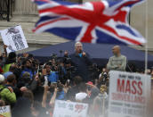 English conspiracy theorist David Icke speaks during a 'We Do Not Consent' rally at Trafalgar Square, organised by Stop New Normal, to protest against coronavirus restrictions, in London, Saturday, Sept. 26, 2020. (AP Photo/Frank Augstein)