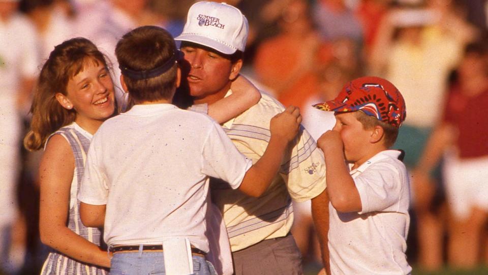 Mark McCumber of Jacksonville celebrates his 1988 Players victory with his daughter Addison (left) and nephew Cort.