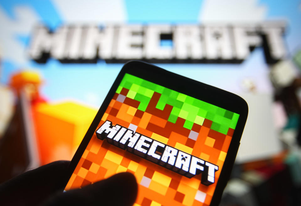 UKRAINE - 2021/08/31: In this photo illustration a Minecraft logo is seen on a smartphone screen. (Photo Illustration by Pavlo Gonchar/SOPA Images/LightRocket via Getty Images)