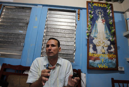 FILE PHOTO: Cuban dissident Jose Daniel Ferrer gives an interview to Reuters inside his home in Palmarito de Cauto March 25, 2012. REUTERS/Mariana Bazo/File Photo