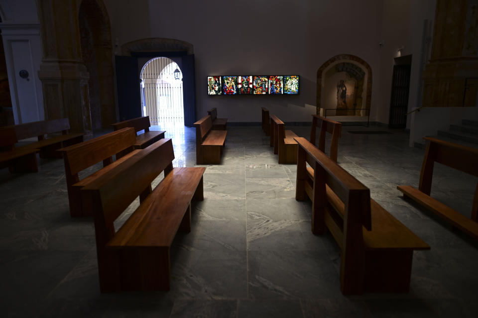Pews stand in the San Jose Church as it reopens after reconstrution in San Juan, Puerto Rico, Tuesday, March 9, 2021. The second oldest in age only to the Spanish cathedral in the neighboring Dominican Republic, it was shuttered in 1996 due to serious deterioration. (AP Photo/Carlos Giusti)