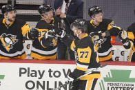 Pittsburgh Penguins' Jeff Carter (77) returns to the bench after scoring during the first period of an NHL hockey game against the New Jersey Devils in Pittsburgh, Tuesday, April 20, 2021. (AP Photo/Gene J. Puskar)