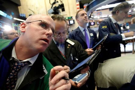 Traders work on the floor of the New York Stock Exchange (NYSE) in New York City, NY, U.S. November 23, 2016. REUTERS/Brendan McDermid