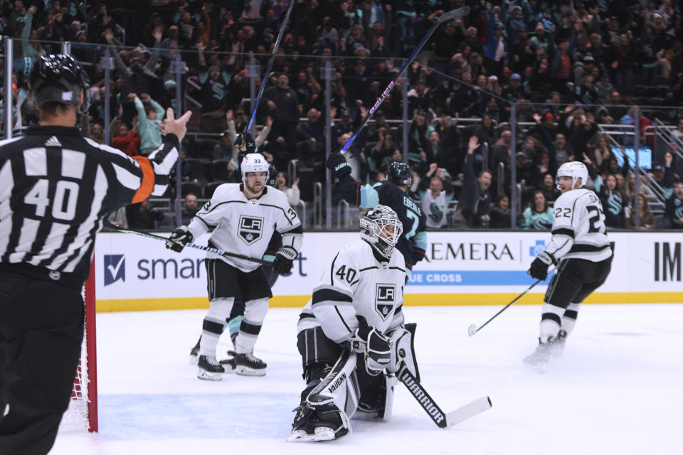 Los Angeles Kings, including goaltender Cal Petersen (40), react after Seattle Kraken right wing Jordan Eberle (7) scored in overtime of an NHL hockey game Saturday, Nov. 19, 2022, in Seattle. The Kraken won 3-2. (AP Photo/Jason Redmond)