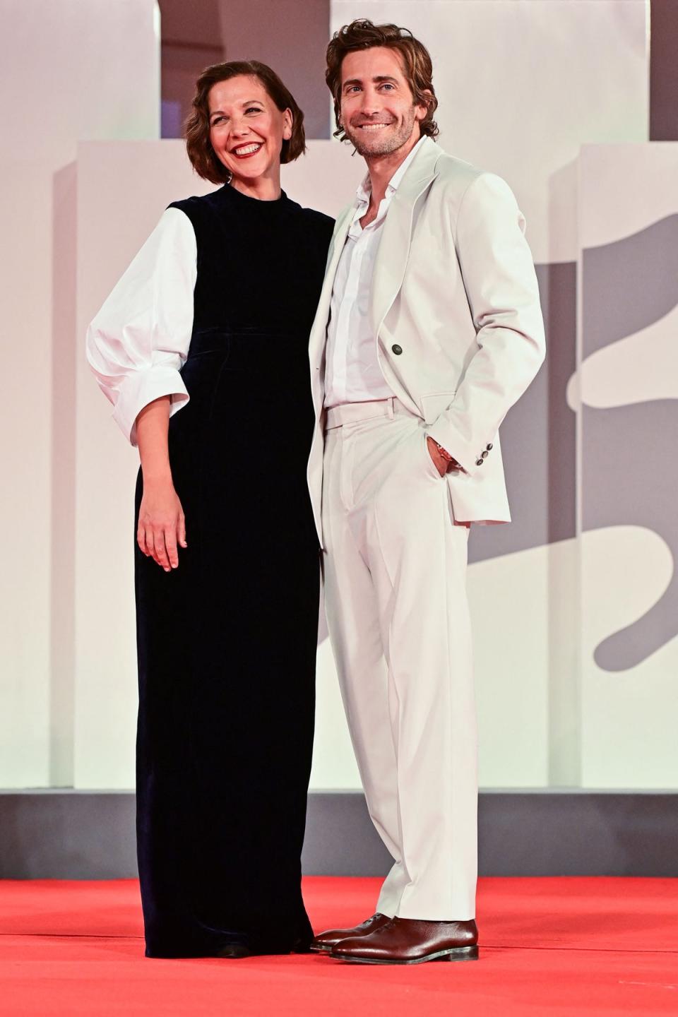 Maggie Gyllenhaal and her brother Jake Gyllenhaal arrive for the screening of the film “The Lost Daughter” presented in competition on September 3, 2021 (AFP via Getty Images)