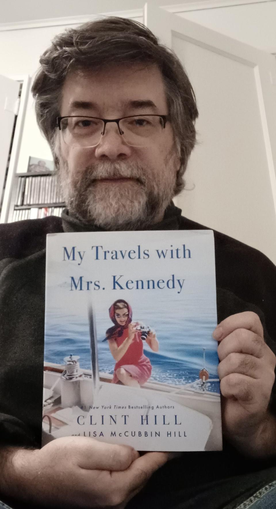 Daily Telegram history columnist Dan Cherry holds a copy of "My Travels with Mrs. Kennedy," a new book by retired Secret Service agent Clint Hill and his wife, Lisa McCubbin Hill.