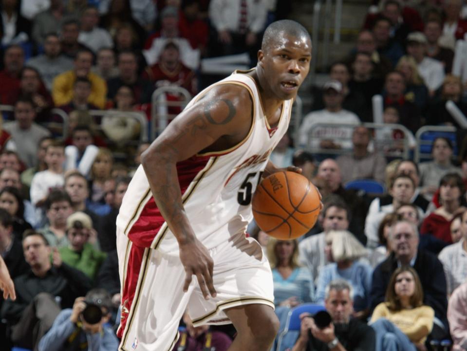 Eric Williams dribbles the ball up the court during a game in 2003.