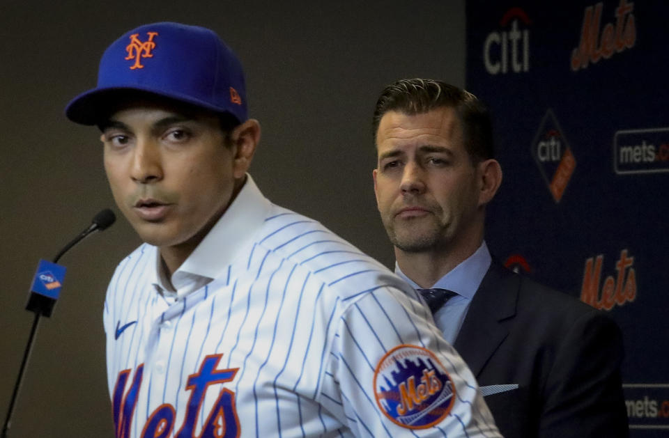 New York Mets vice president & general manager Brodie Van Wagenen, right, listens as new Mets manager Luis Rojas speaks during a news conference, Friday, Jan. 24, 2020, in New York. (AP Photo/Bebeto Matthews)