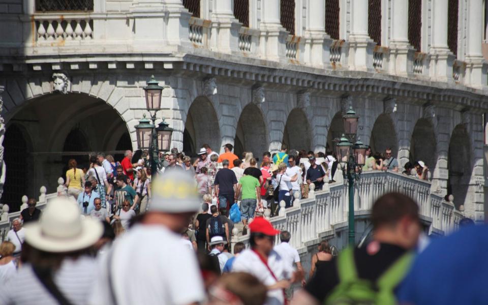 Tourists in Venice - Stone RF/Getty