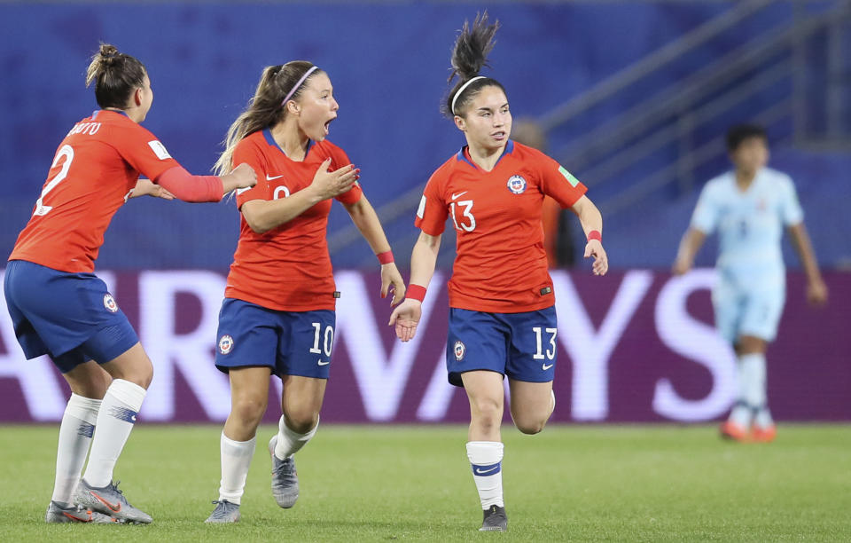 Chile's Rocio Soto, Yanara Aedo and Javiera Grez, from left to right, celebrate their first goal during the Women's World Cup Group F soccer match between Thailand and Chile at the Roazhon Park in Rennes, France, Thursday, June 20, 2019. (AP Photo/David Vincent)