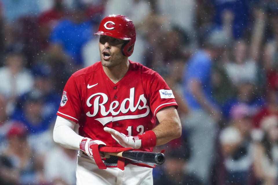 Cincinnati Reds' Curt Casali reacts after drawing a bases-loaded walk during the ninth inning of the team's baseball game against the Los Angeles Dodgers in Cincinnati, Tuesday, June 6, 2023. (AP Photo/Aaron Doster)