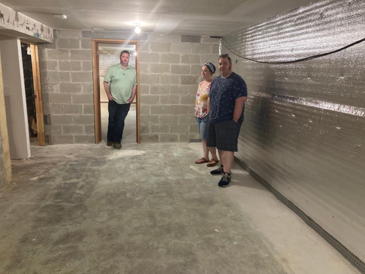 Realtor Sean Ryan leans in the doorway in the basement of Myke and Julia Ricca's house in the Goldenridge section of Levittown. The house is on Goldengate Road, Bristol Township.