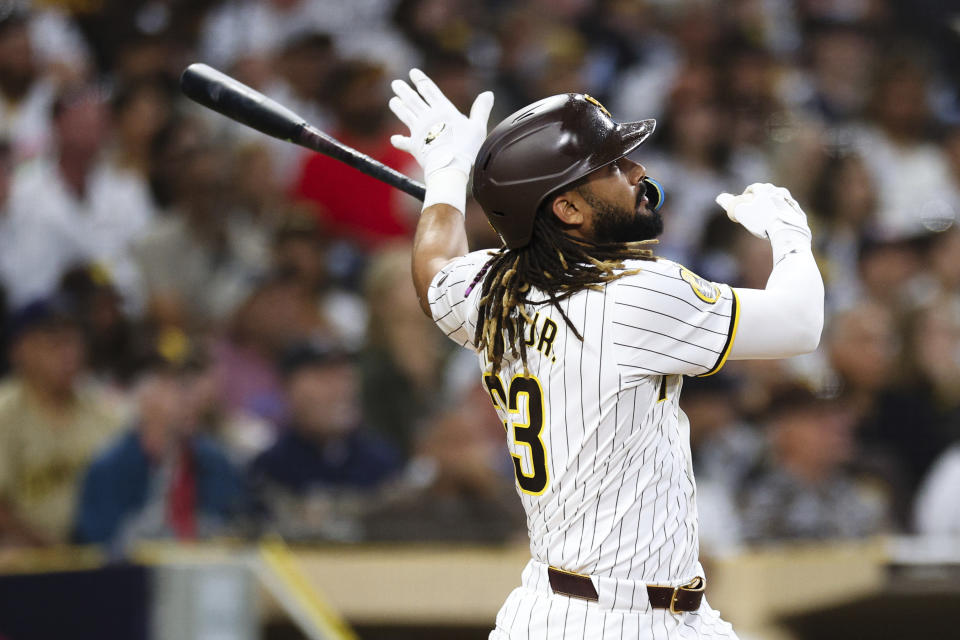 San Diego Padres' Fernando Tatis Jr. tosses his bat after hitting a solo home run against the Milwaukee Brewers during the fifth inning of a baseball game Thursday, June 20, 2024, in San Diego. (AP Photo/Derrick Tuskan)