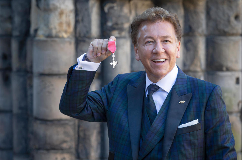 Television and radio presenter Ross King after receiving his (Member of the Order of the British Empire) MBE for services to broadcasting, the arts and charity from Queen Elizabeth II during an Investiture ceremony at the Palace of Holyroodhouse in Edinburgh.