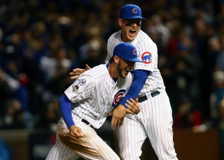 October 13, 2015; Chicago, IL, USA; Chicago Cubs third baseman Kris Bryant (17) and first baseman Anthony Rizzo (44) celebrate the 6-4 victory and against St. Louis Cardinals in game four of the NLDS at Wrigley Field. Mandatory Credit: Jerry Lai-USA TODAY Sports