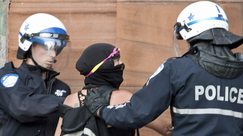 Police apprehend a protester in downtown Montreal. Security measures around this year's Canadian Grand Prix events are unusually tight.