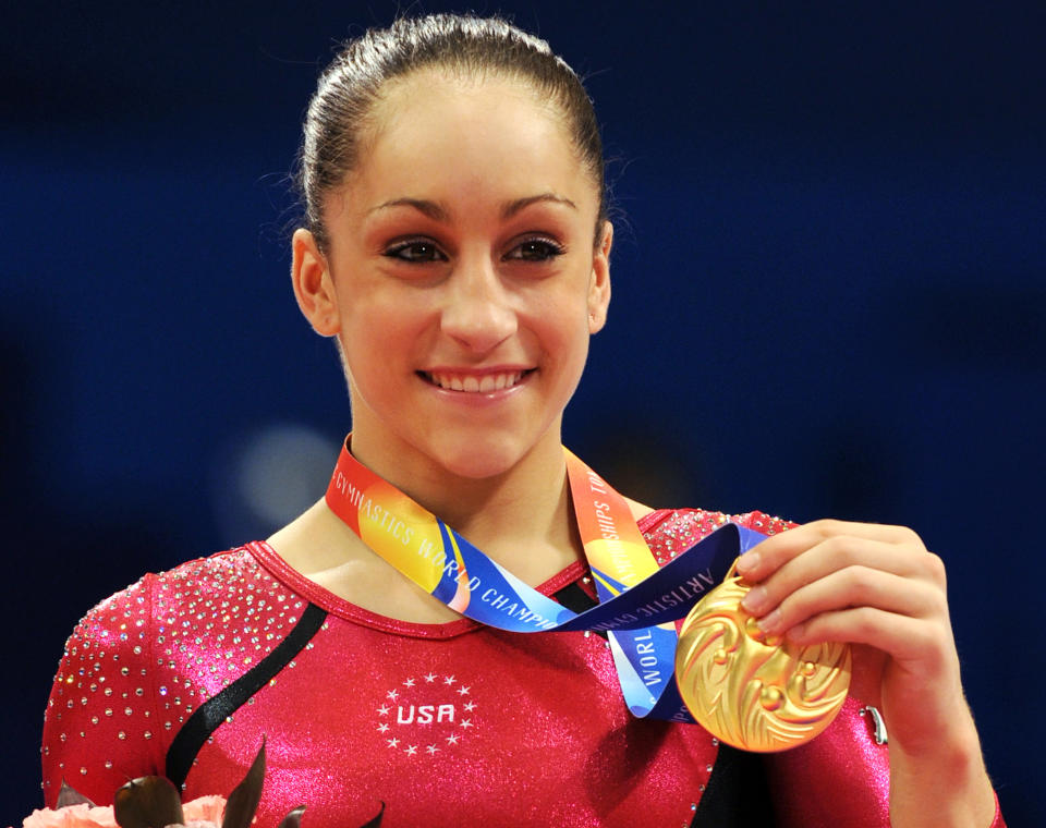 Women's individual all-round winner Jordyn Wieber of US shows off her gold medal on the podium during the medal presentation ceremony at the World Gymnastics Chmapionships in Tokyo on October 13, 2011. Wieber won the women's all-around title at the world gymnastics championships with a dramatic comeback in the final event.    AFP PHOTO / TOSHIFUMI KITAMURA (Photo credit should read TOSHIFUMI KITAMURA/AFP/Getty Images)