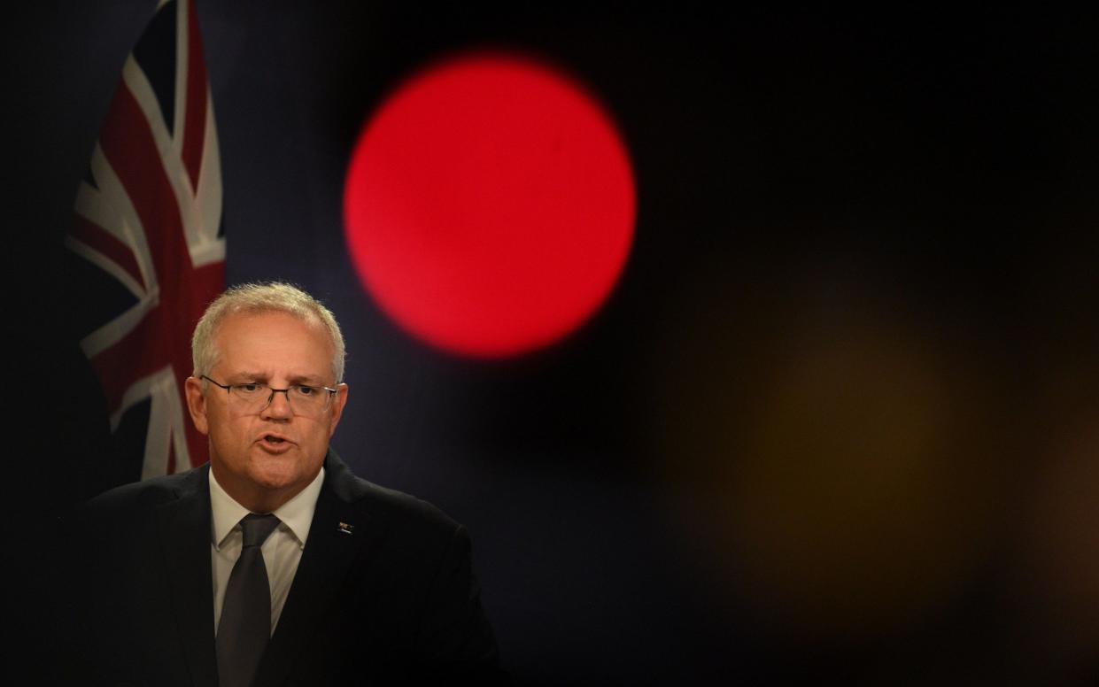 Australia's prime minister, Scott Morrison, holds a press conference after Italy blocked the export of AstraZeneca's Covid vaccine to the country - Dean Lewins/Shutterstock