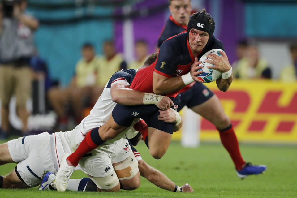 England's Piers Francis runs against the United States defense during the Rugby World Cup Pool C game at Kobe Misaki Stadium, between England and the United States in Kobe, Japan, Thursday, Sept. 26, 2019. (AP Photo/Christophe Ena)