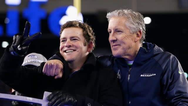 John Schneider and Pete Carroll celebrate after their 43-8 victory over the Denver Broncos during Super Bowl XLVIII.
