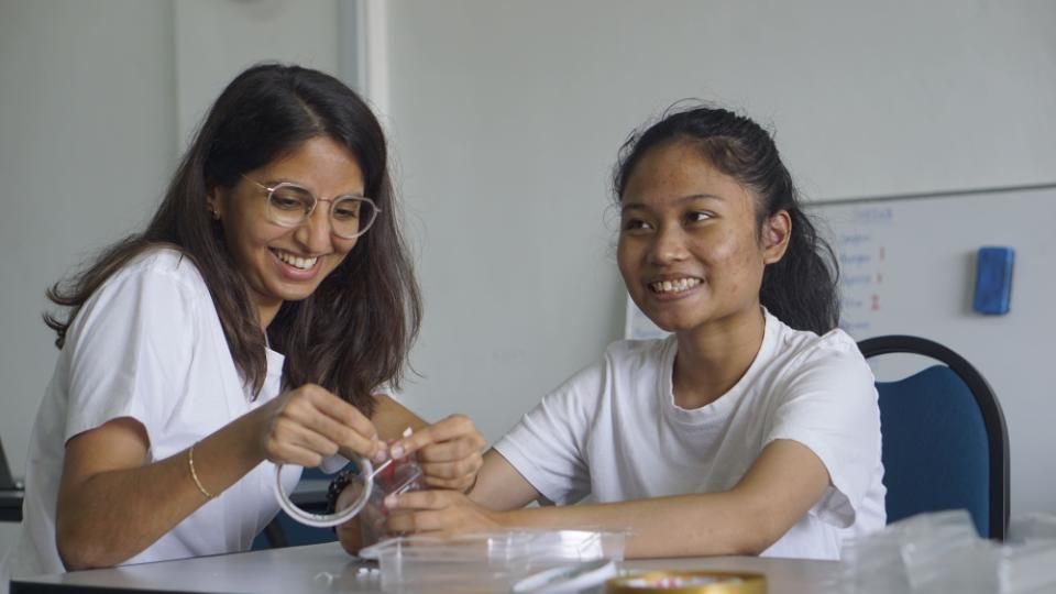 The founder of EmployAble, Ivy Philip with one of their trainees during the Polis Evo 3 packaging process. — Picture by Arif Zikri