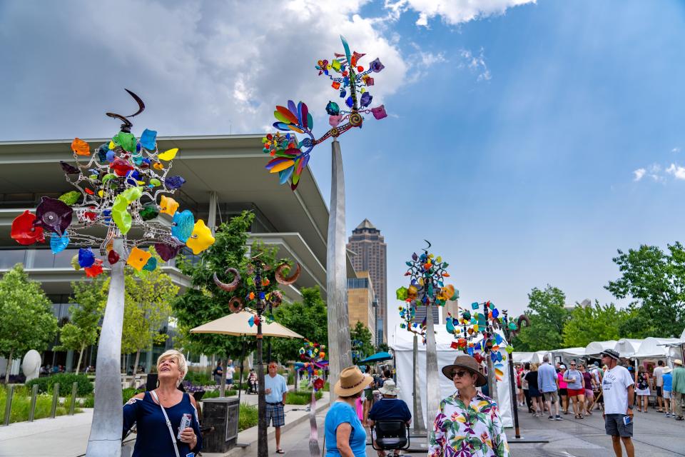 Kinetic sculptures by Andrew Carson along Grand Ave. during the Des Moines Arts Festival, Friday, June 23, 2023. 