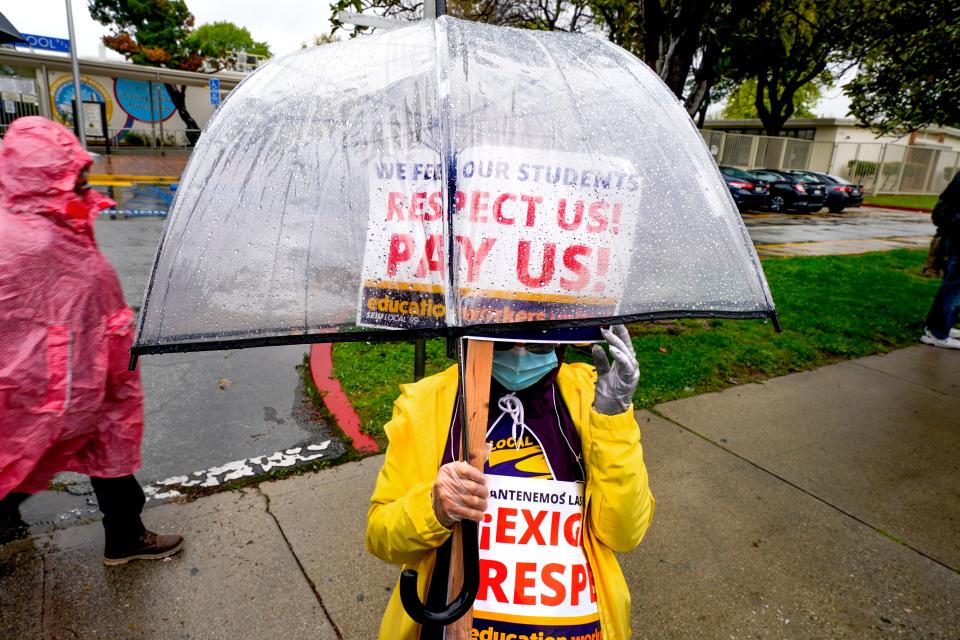 Striking Los Angeles Unified School District employees picket in front of Monroe High School. More than 60,000 bus drivers, custodians, cafeteria employees, campus security, teaching assistants and educators from the Los Angeles Unified School District are striking from March 21 to 23. They demand a 30% raise and a $2 per hour equity wage increase.